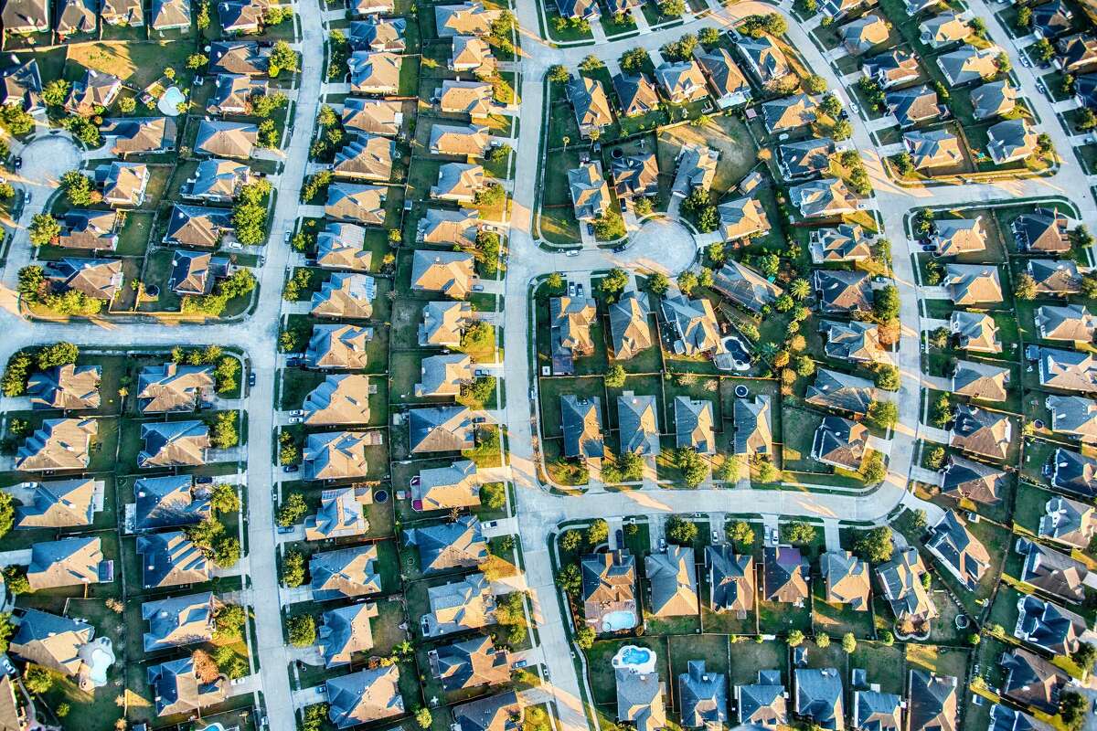 Aerial view of a suburban development in an exclusive planned residential community in the suburban metropolitan Houston, Texas area.