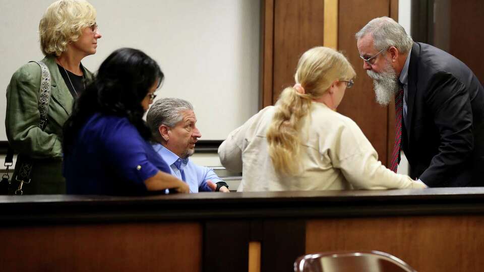 Galveston County District Attorney Jack Roady, right, talks with Flo and Scot Rice, Rosie Yanas-Stone and Gail McLeod after a hearing in the civil lawsuit against accused Santa Fe High School shooter Dimitrios Pagourtzis’ parents Tuesday, May 7, 2024, in Judge Jack Ewing’s County Court No. 3 at the Galveston County Courthouse.