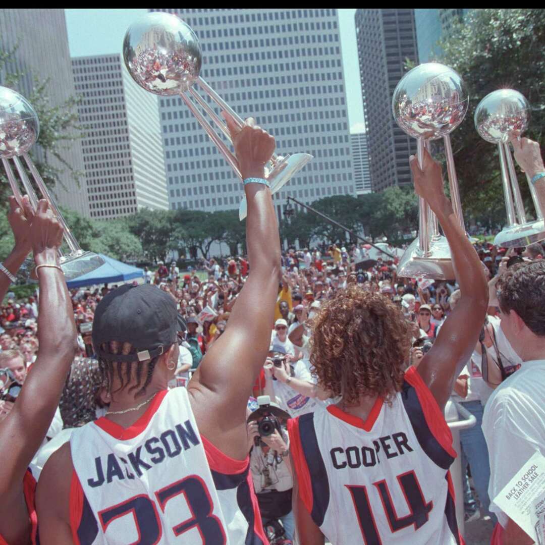 (8/29/00) The Comet's players Sheryl Swoopes, Tammy Jackson, Cynthia Cooper, and Coach Van Chancellor hold up their four WNBA championship trophies during the Comet's rally at City Hall. (Karen Warren/Houston Chronicle) HOUCHRON CAPTION (08/30/2000): Houston Comets stars Sheryl Swoopes, left, Tammy Jackson, Cynthia Cooper and Coach Van Chancellor brandish the team's four WNBA championship trophies Tuesday during a rally at City Hall that followed a parade through downtown.