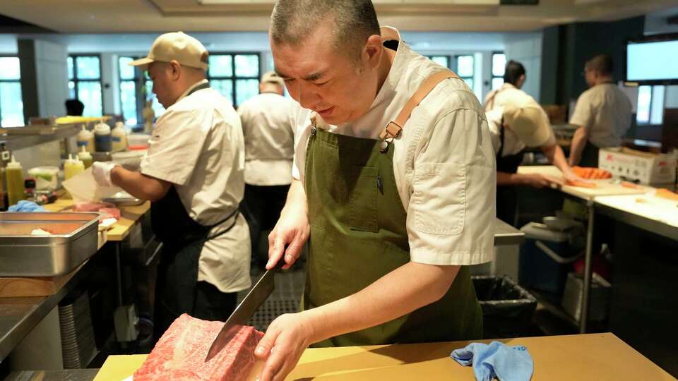 Chef Manabu Horiuchi slices a piece of Matsusaka wagyu at Katami, 2701 West Dallas St., Wednesday, May 8, 2024, in Houston.