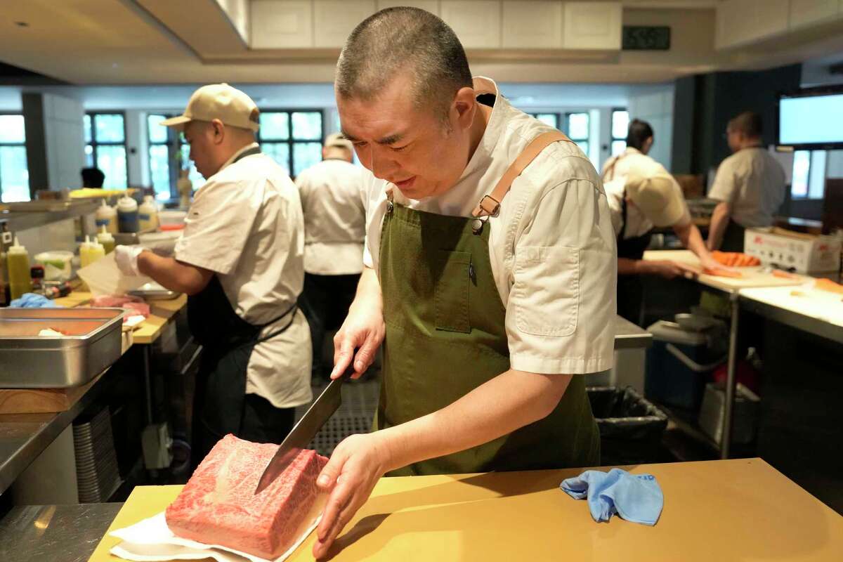 Chef Manabu Horiuchi slices a piece of Matsusaka wagyu at Katami, 2701 West Dallas St., Wednesday, May 8, 2024, in Houston.