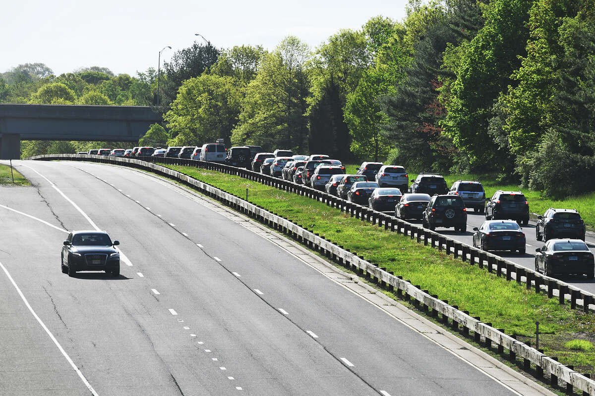 The Merritt Parkway southbound, left, remained closed early Thursday near the site of a head on crash overnight that killed four people, in Stratford, Conn. May 9, 2024.