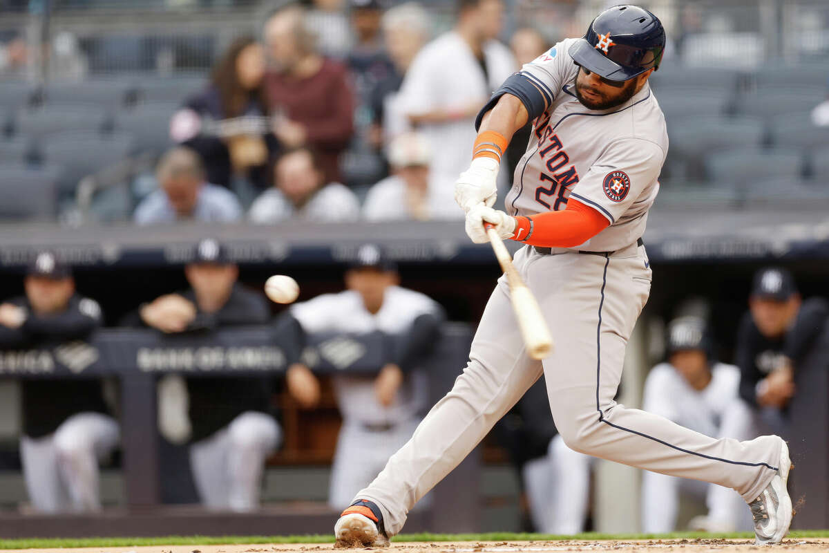 Jon Singleton #28 of the Houston Astros hits a two-run home run during the first inning against the New York Yankees at Yankee Stadium on May 09, 2024 in the Bronx borough of New York City.