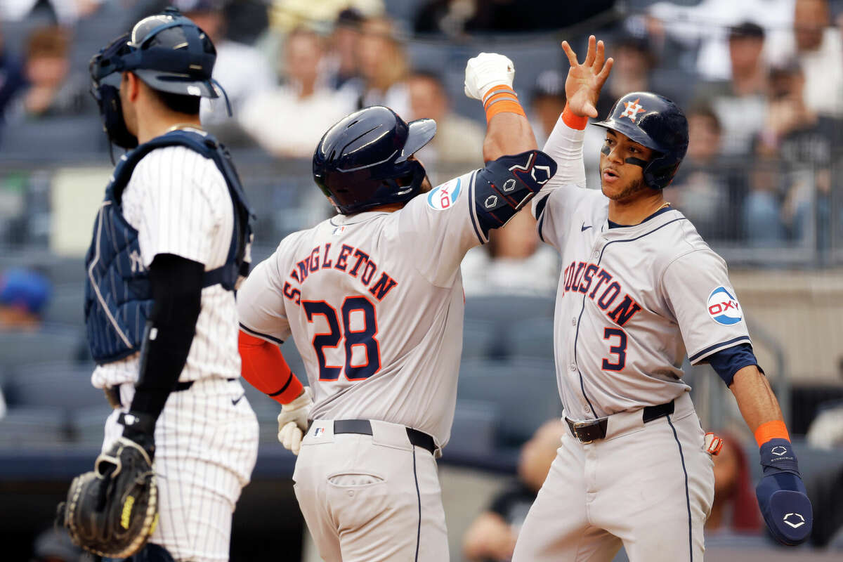 Jon Singleton #28 celebrates with Jeremy Peña #3 of the Houston Astros after Singleton's two-run home run during the first inning against the New York Yankees at Yankee Stadium on May 09, 2024 in the Bronx borough of New York City.