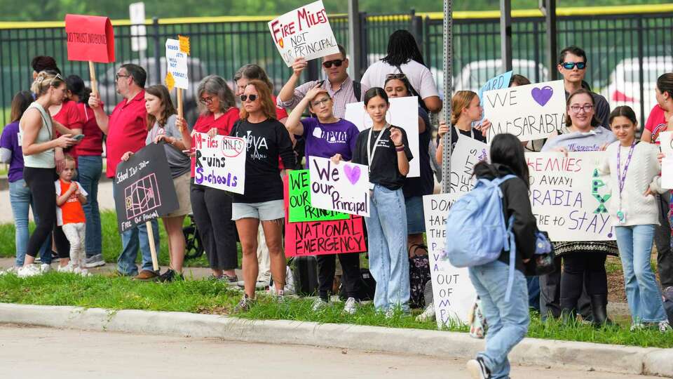 Meyerland Performing and Visual Arts Middle School parents and students demonstrate against the resignation notice of Principal Auden Sarabia on Monday, May 13, 2024 in Houston. Sarabia told staff he must either resign by Tuesday or go before the district's Board of Managers.