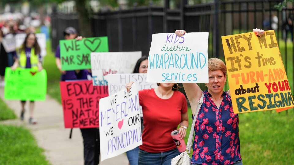 Meyerland Performing and Visual Arts Middle School parents and students demonstrate against the resignation notice of Principal Auden Sarabia on Monday, May 13, 2024 in Houston. Sarabia told staff he must either resign by Tuesday or go before the district's Board of Managers.