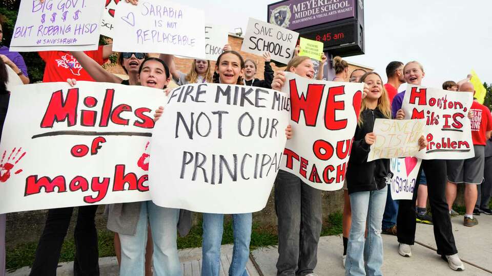 Meyerland Performing and Visual Arts Middle School parents and students demonstrate against the resignation notice of Principal Auden Sarabia on Monday, May 13, 2024 in Houston. Sarabia told staff he must either resign by Tuesday or go before the district's Board of Managers.