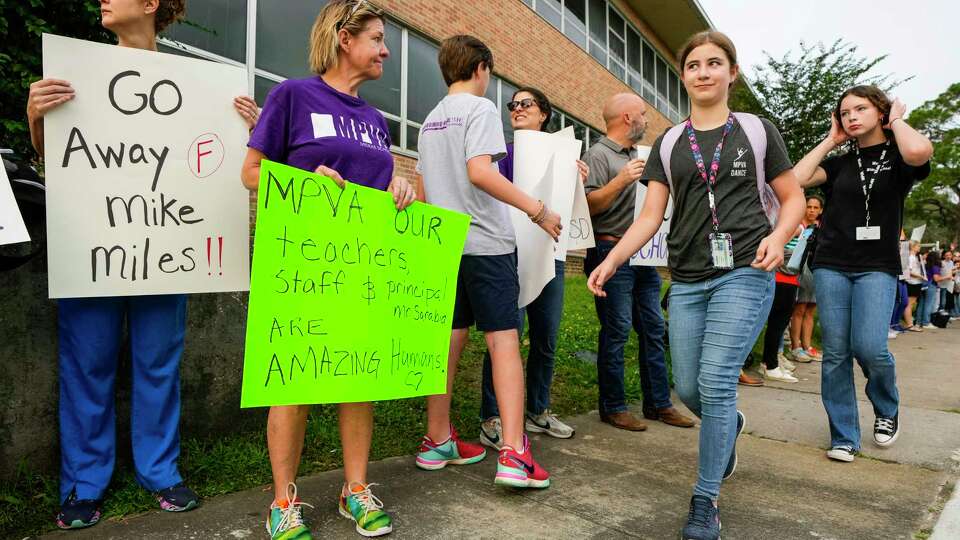 Meyerland Performing and Visual Arts Middle School parents and students demonstrate against the resignation notice of Principal Auden Sarabia on Monday, May 13, 2024 in Houston. Sarabia told staff he must either resign by Tuesday or go before the district's Board of Managers.