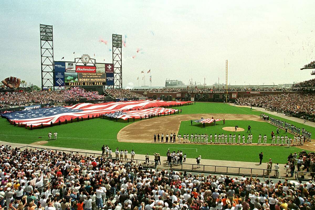 The Los Angeles Dodgers and the San Francisco Giants line-up during the San Francisco Giants Opening Day at their new Pacific Bell Park on April 11, 2000 in San Francisco.