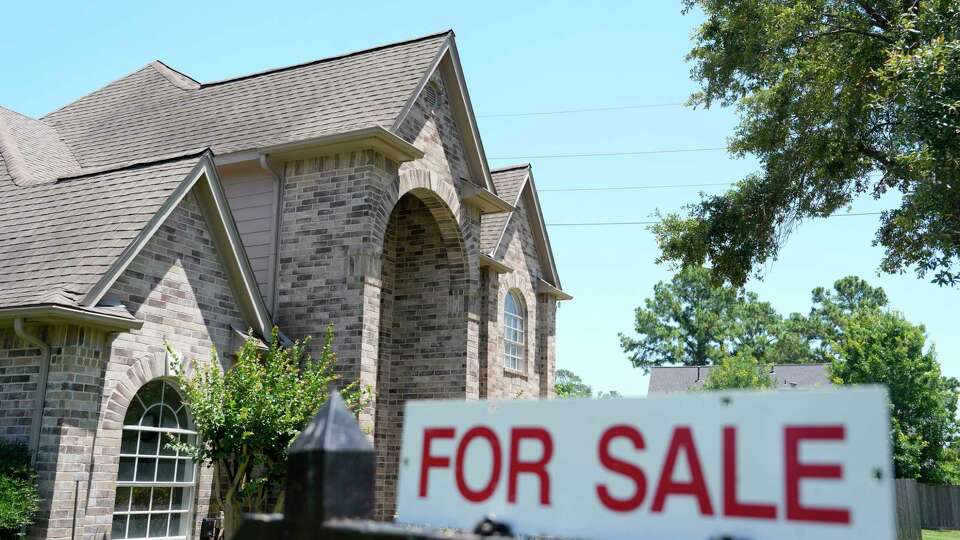 A for sale real estate sign is shown outside a home in the Memorial Northwest neighborhood Tuesday, May 14, 2024, in Spring.