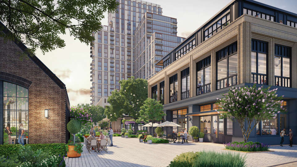 Cobblestone pathways and greenery invite visitors to meander through the retail buildings within The RO, a new mixed-use project planned on Buffalo Speedway by Transwestern Development Company. In the background is the 28-story apartment tower within the development. 