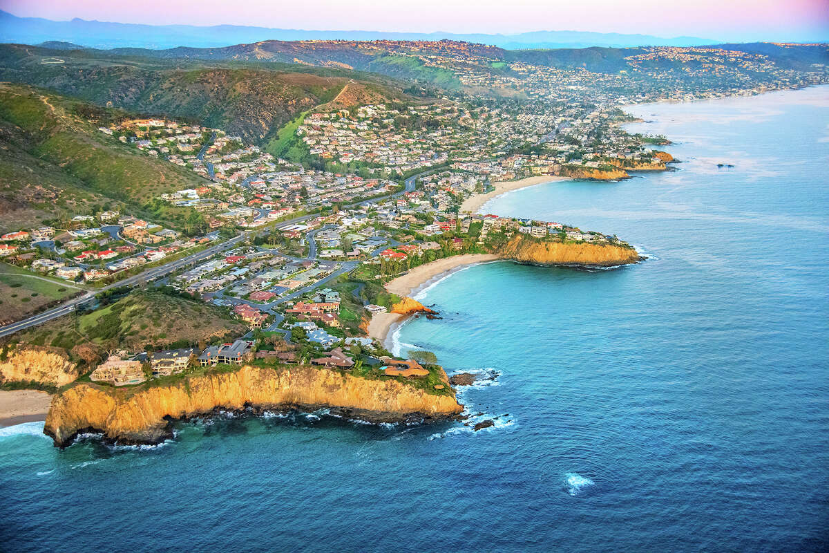 FILE - Wide angle aerial view of the homes along the beautiful coastal cliffs of Laguna Beach, California.