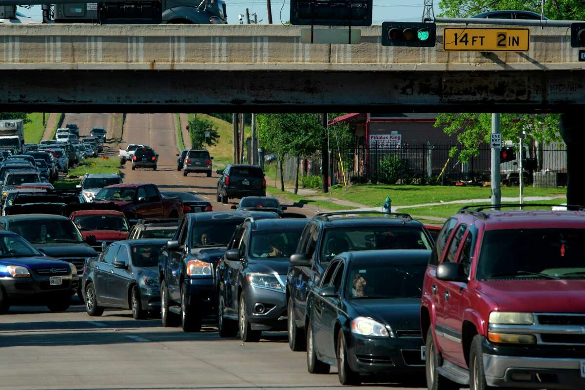 Cars are lined up in traffic on Airline Drive after a food distribution site at Reyes Produce opened on April 13, 2020 in Houston, Texas.