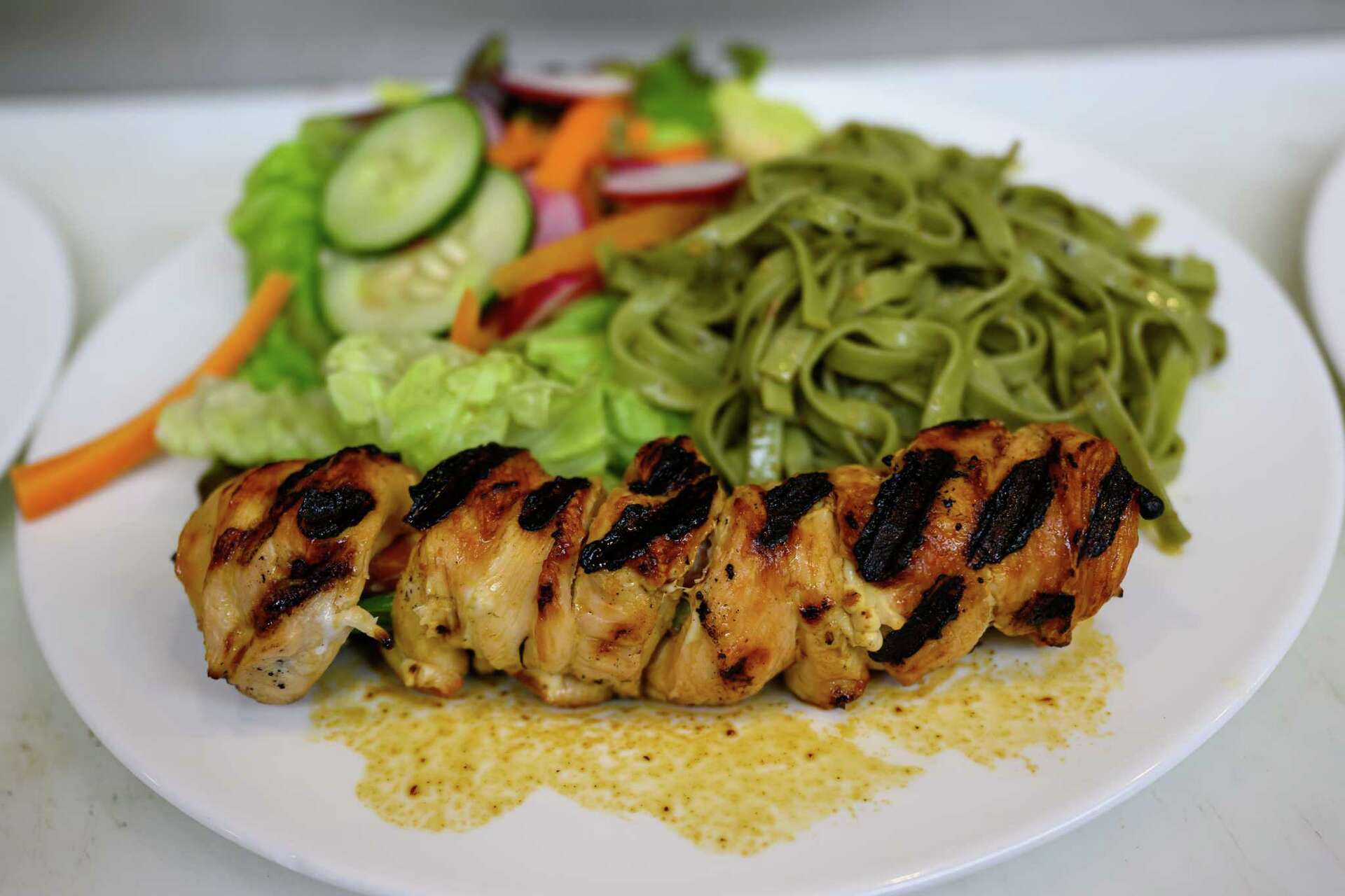 Quintessence teriyaki chicken, spinach noodles available at 4 spots