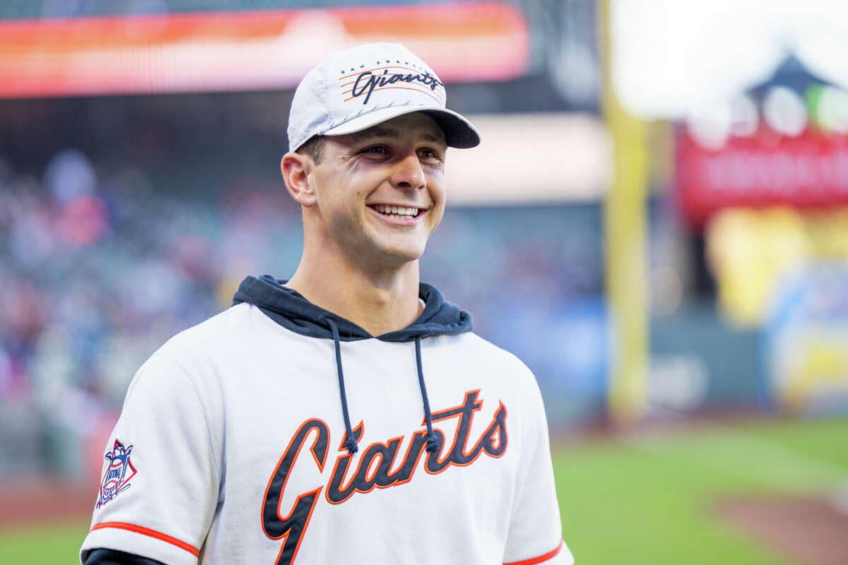 San Francisco 49ers quarterback Brock Purdy walks the sidelines before the MLB baseball game between the Los Angeles Dodgers and San Francisco Giants on May 14, 2024 at Oracle Park in San Francisco.