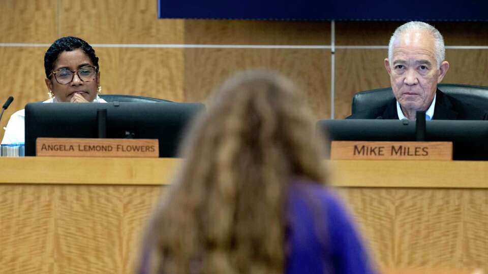 Houston ISD board of managers member Angela Lemond Flowers, left, and Superintendent Mike Miles listen as a student speaks during the district's first public budget workshop for the 2024-2025 school year at the Hattie Mae White Educational Support Center, Thursday, May 15, 2024, in Houston.