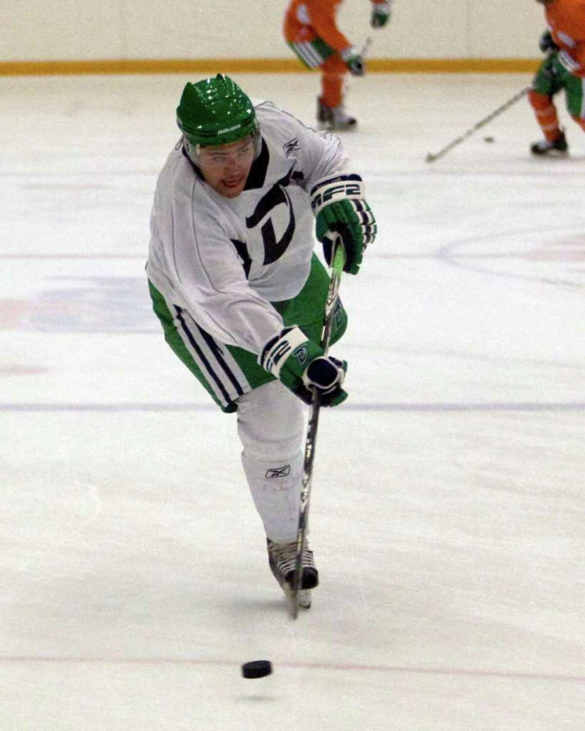 The Whalers' Devon Guy fires a shot during practice Thursday at the Danbury Ice Arena.