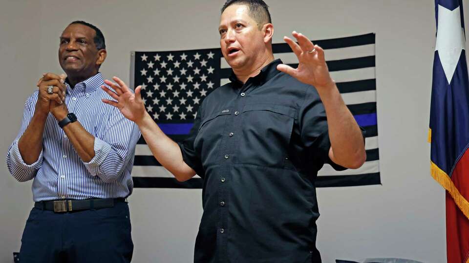 Congressman Tony Gonzales talks to campaign workers while guest Burgess Owens, U.S. representative for Utah's 4th congressional district listens at a campaign event on Saturday, May 11, 2024 at 4503 De Zavala Road.