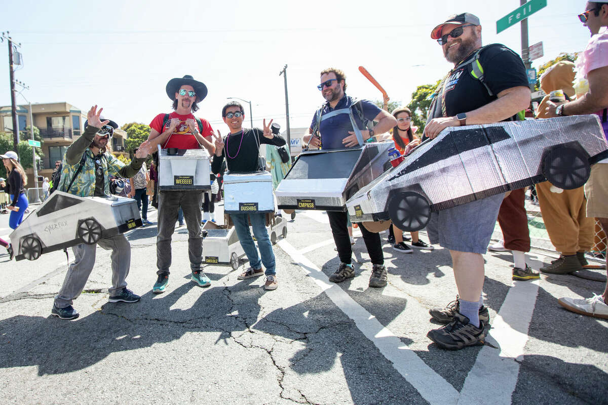 Bay to Breakers runners in Cybertrucks take a pause during the San Francisco race on May 19, 2024.