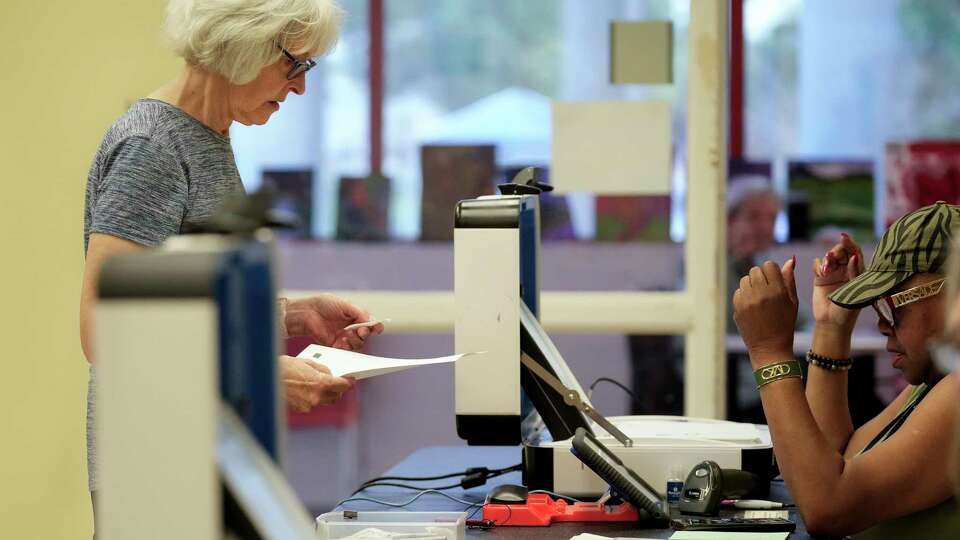 People vote on the first day of early voting for the Primary Runoff Elections Monday, May 20, 2024 at Metropolitan MultiService Center in Houston.