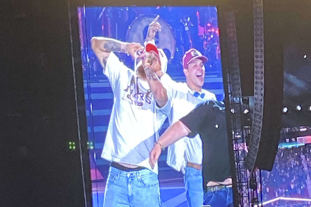 Brock Purdy and George Kittle appeared onstage during Luke Combs' Saturday night show at Levi's Stadium.