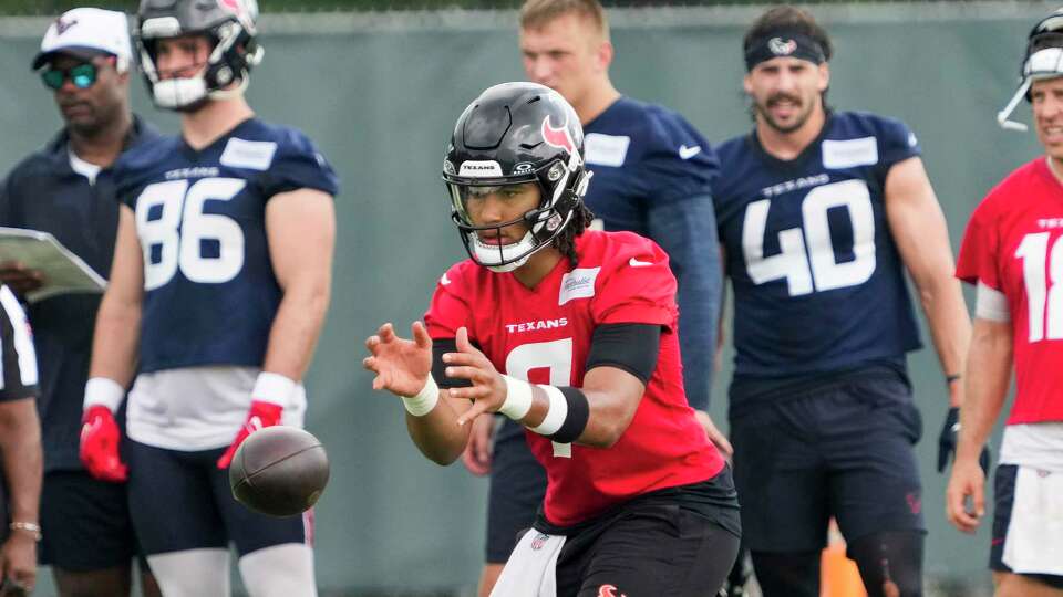 Houston Texans quarterback C.J. Stroud takes a snap during an NFL football OTA practice on Tuesday, May 21, 2024, at Houston Methodist Training Center in Houston.