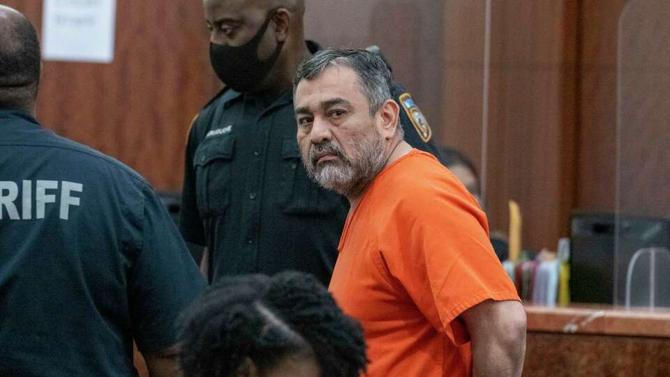 Hernan Torres, Sr. is escorted out of Harris County 338th District Court after appearing before Judge Ramona Franklin Tuesday, May 21, 2024 in Houston.