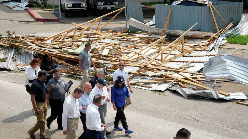 FEMA Administrator Deanne Criswell, center, visits damaged apartment complex on 8500 block Pitner Road with Houston Mayor John Whitmire, to her right, and Harris County Precinct 4 Commissioner Lesley Briones, to her left, Tuesday, May 21, 2024 at Spring Branch in Houston.