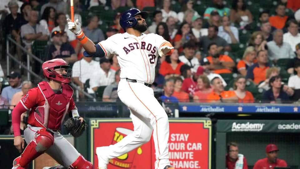 Houston Astros Jon Singleton (28) hits a two-run home run to tie the game during the sixth inning of an MLB baseball game at Minute Maid Park on Wednesday, May 22, 2024, in Houston.