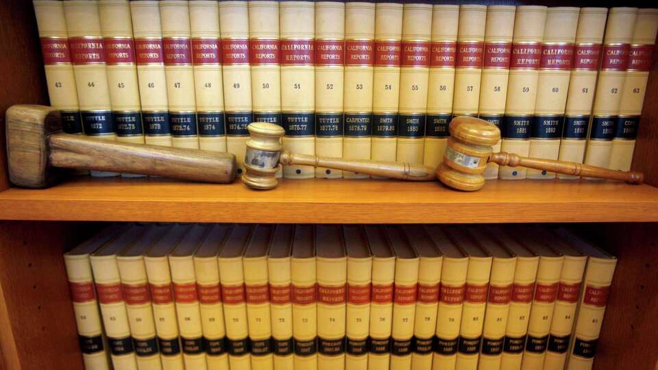 FILE-- Gavels and law books are shown, July 14, 2010 in San Francisco, Calif. The Senate is set to confirm the 200th federal judge of President Joe Biden's tenure. That's about a month before then-President Donald Trump hit the 200 threshold. Trump still holds the edge when it comes to the most impactful confirmations — those to the U.S. Supreme Court and the country's 13 appellate courts.