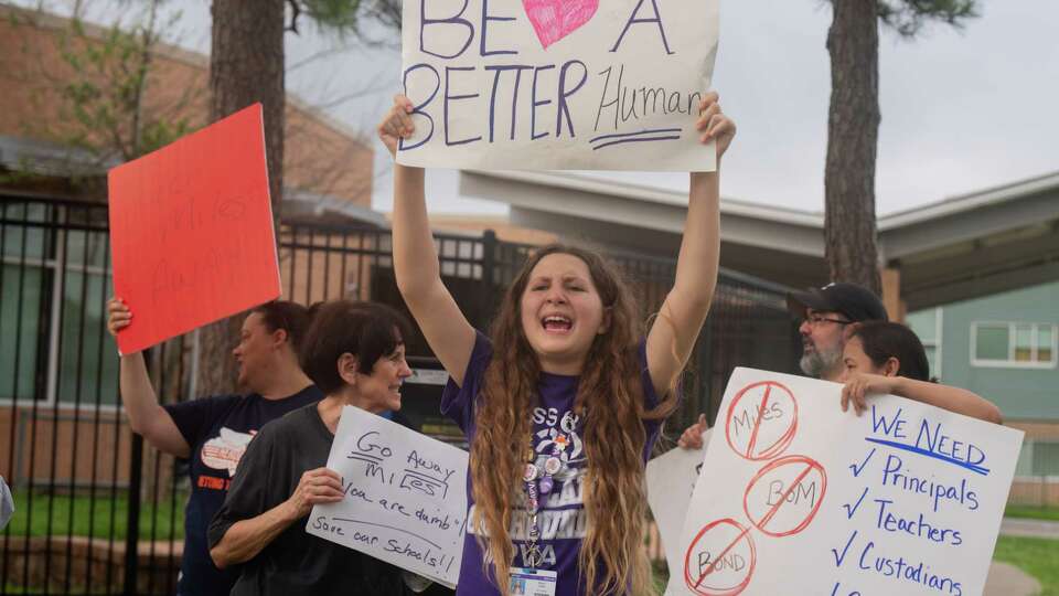 Brynn Cabe, 12, center, a 7th grade student at Meyerland Performing and Visual Arts Middle School, protested alongside parents and HISD students outside Gary L. Herod Elementary School in the in the Maplewood/Meyerland West area in Southwest Houston, TX on Wednesday, May 22, 2024. Parents say their principal and several teachers are being being forced out.