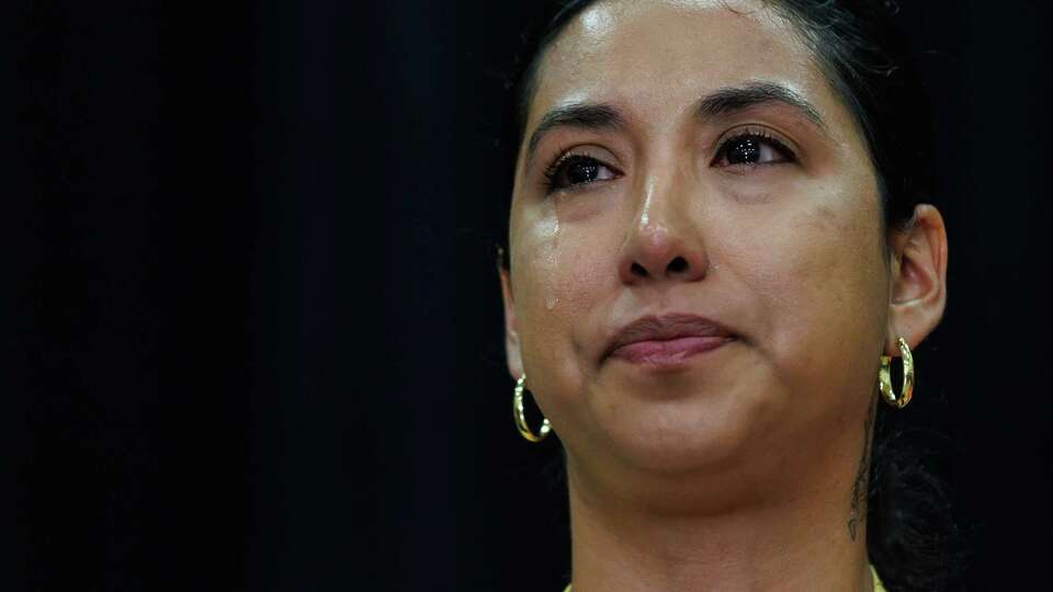 A tear falls down Kimberly Mata-Rubio’s cheek as stands with her attorneys and other Uvalde families during a press conference with their lawyers Josh Koskoff and Erin Rogiers at the SSGT Willie de Leon Civic Center on Wednesday, May 22, 2024, in Uvalde, Texas. Mata-Rubio’s daughter Lexi Rubio was killed in the Robb Elementary shooting. Days before the 2-year mark of the mass shooting that killed 19 fourth-graders and two teachers, the group announced a settlement with the city of Uvalde.