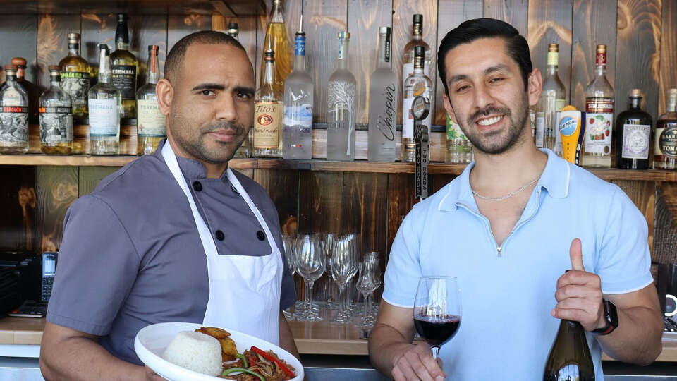 Chef Vladimir Tolentino Collado, left, and co-owner Andres Diaz, right, work together at Costo Vino, which opened at 36 Westport Ave. in Norwalk in January.