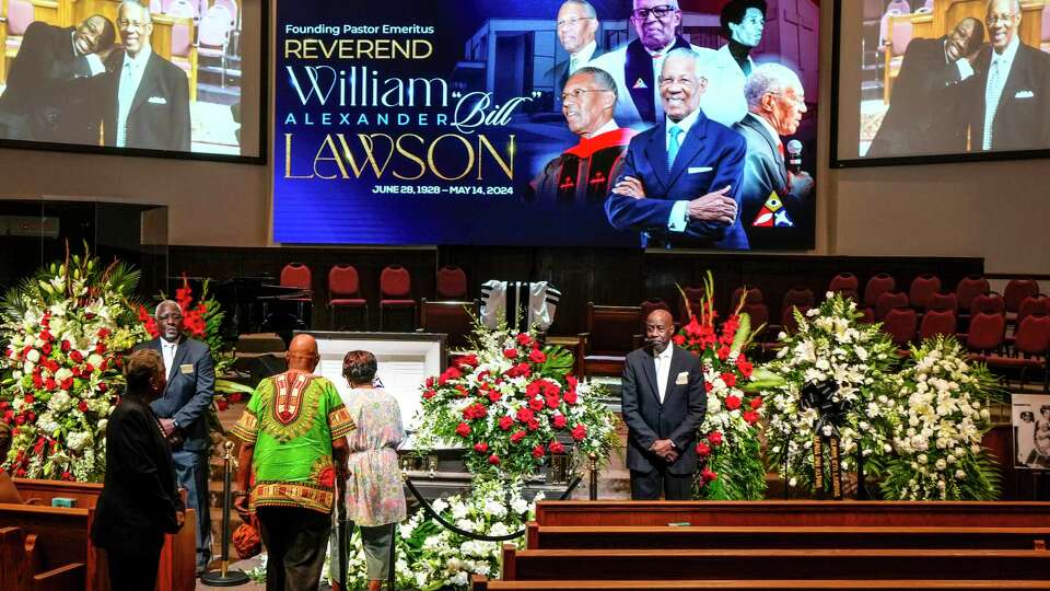 Mourners pay their respects for The Rev. William 