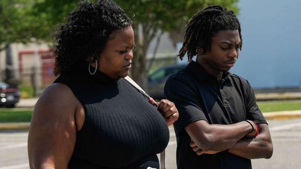 Darryl George,18, stands next to his mother, Darresha George in front of Galveston County Court House on Thursday, May 23, 2024, in Galveston. George will spend the remainder of the year in in-school suspension, extending a punishment that was first imposed in August over his hairstyle that district officials say violates their dress code policy.