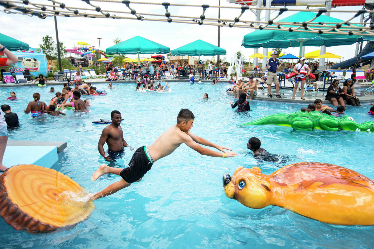 Kids play on a ropes course over the water at Typhoon Texas water park on Saturday, May 28, 2016, in Katy. ( Brett Coomer / Houston Chronicle )