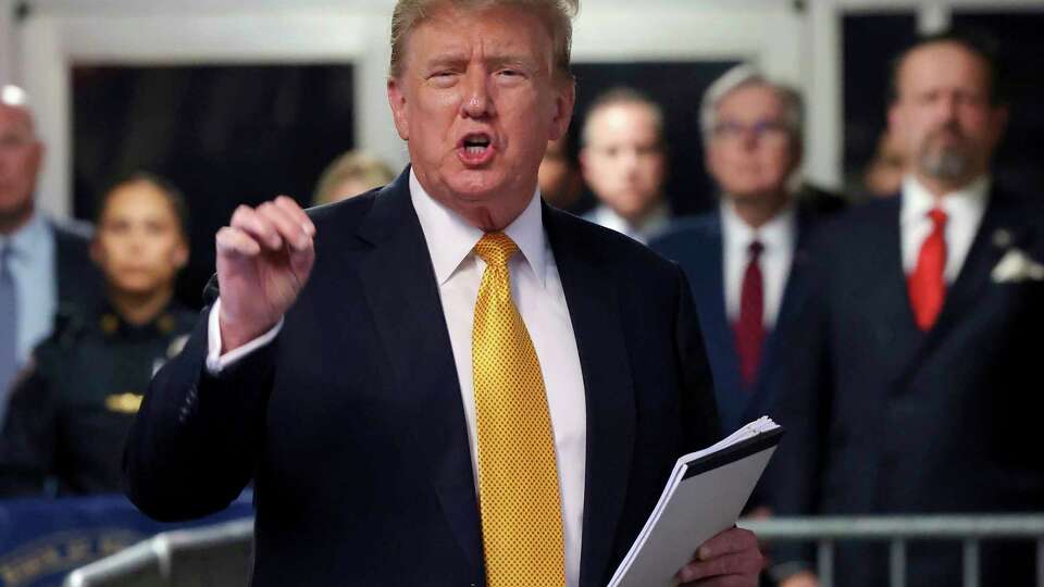 FILE - Former President Donald Trump speaks to reporters at Manhattan Criminal Court, May 21, 2024 in New York. Trump has spent the majority of his time as a criminal defendant sitting nearly motionless for hours, leaning back in his chair with his eyes closed. It is in part a strategy in response to warnings that behaving like he has in past trials could backfire. Trump has also been able to speak several times a day to a gaggle of media camped outside the courtroom, giving him an outlet to vent his frustrations. (Michael M. Santiago/Pool Photo via AP, File)