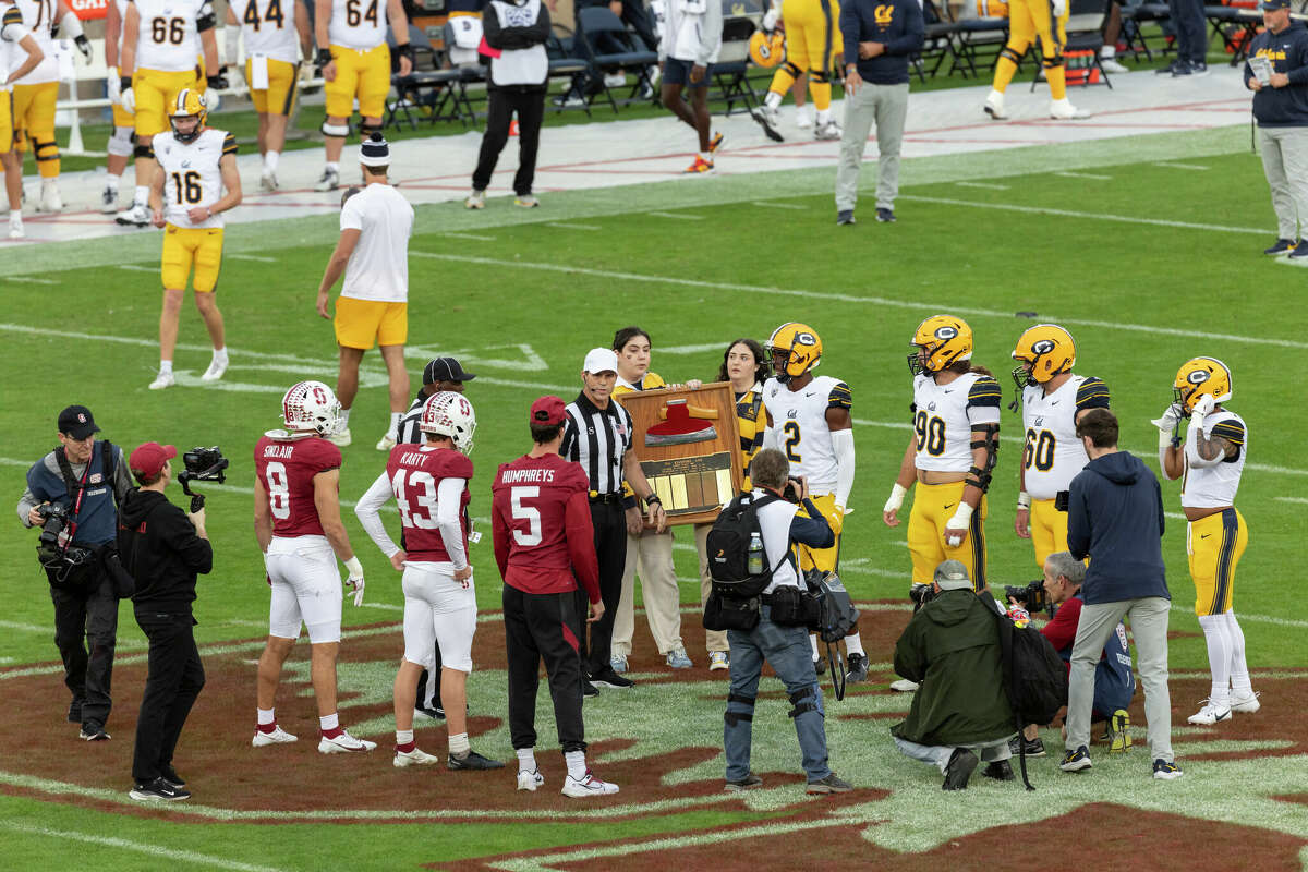 The Stanford Cardinal and the California Golden Bears team captains meet at midfield for the coin toss before the 126th Big Game on November 18, 2023 at Stanford Stadium.