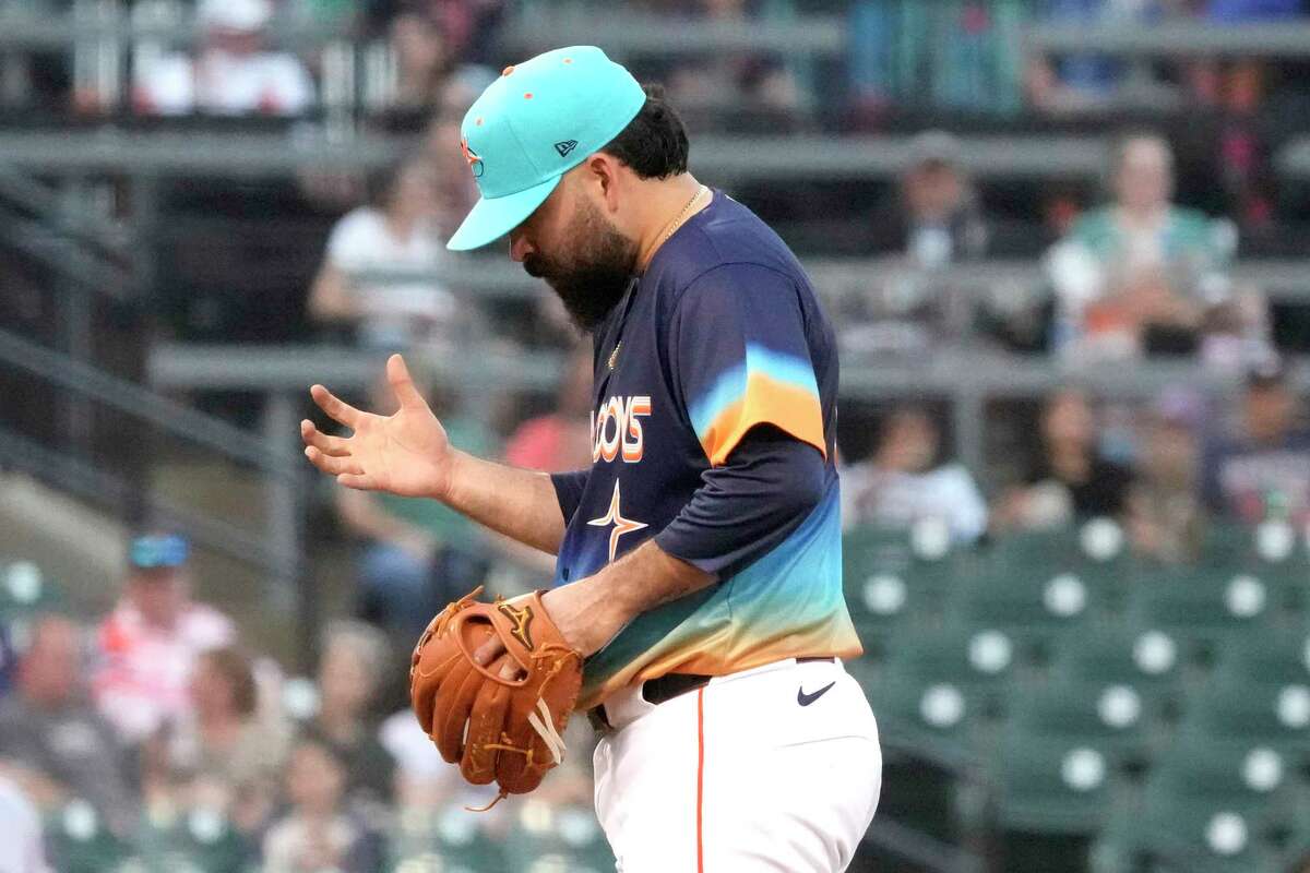 Houston Astros starting pitcher Jose Urquidy (65) looks at his arm during the fourth inning of a minor league baseball game at Constellation Field on Saturday, May 25, 2024, in Sugar Land. He left the game after throwing one test pitch with right forearm discomfort. He had thrown 52 pitches.