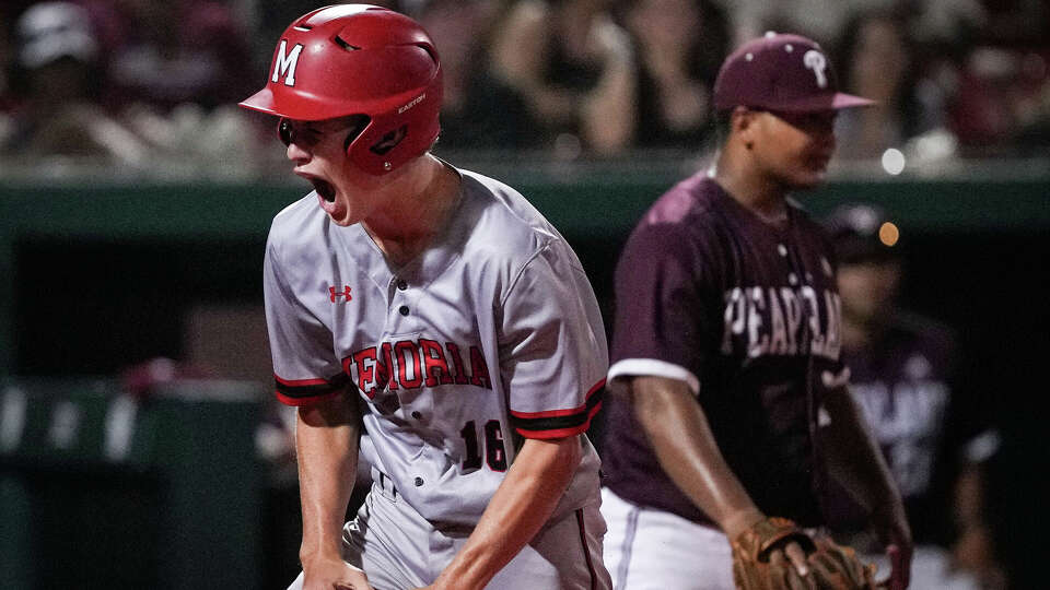 Memorial Mustangs' Issac Richardson (16) celebrates after scoring during the seventh inning of a Region III-6A boys semifinal baseball game Friday, May 24, 2024, at Schroeder Park at the University of Houston in Houston.