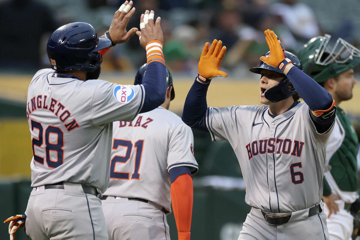 Jake Meyers #6 of the Houston Astros is congratulated by Jon Singleton #28 after he hit a three-run home run against the Oakland Athletics in the fourth inning at Oakland Coliseum on May24, 2024 in Oakland, California. (Photo by Ezra Shaw/Getty Images)