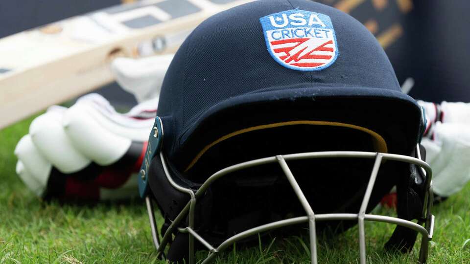 A cricket helmet is seen before the third of a three-game T20I series at the Prairie View Cricket Complex, Saturday, May 25, 2024, in Houston.