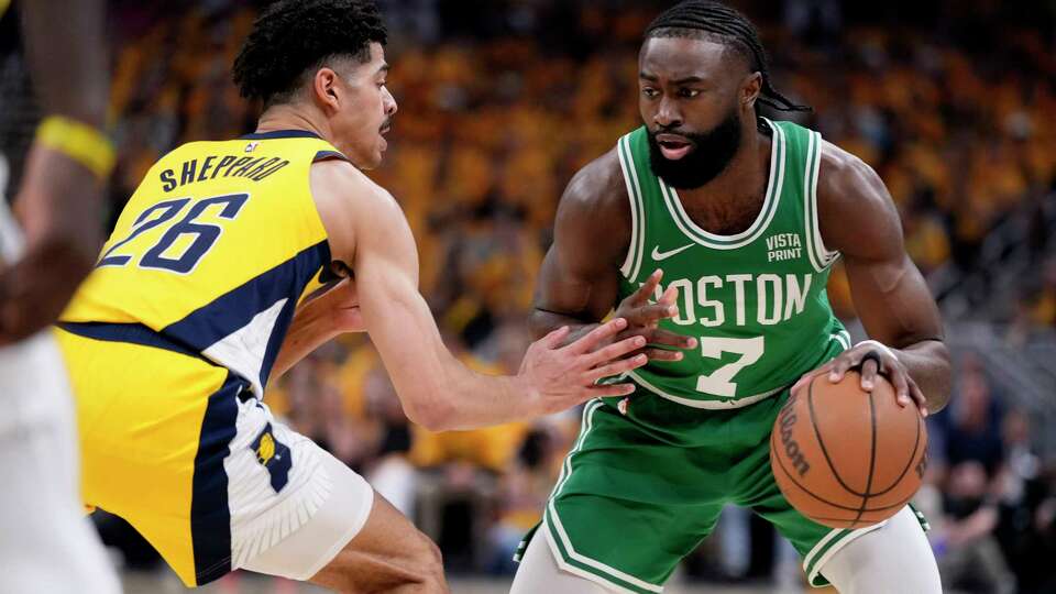 Boston Celtics guard Jaylen Brown (7) drives around Indiana Pacers guard Ben Sheppard (26) during the first half of Game 3 of the NBA Eastern Conference basketball finals, Saturday, May 25, 2024, in Indianapolis.