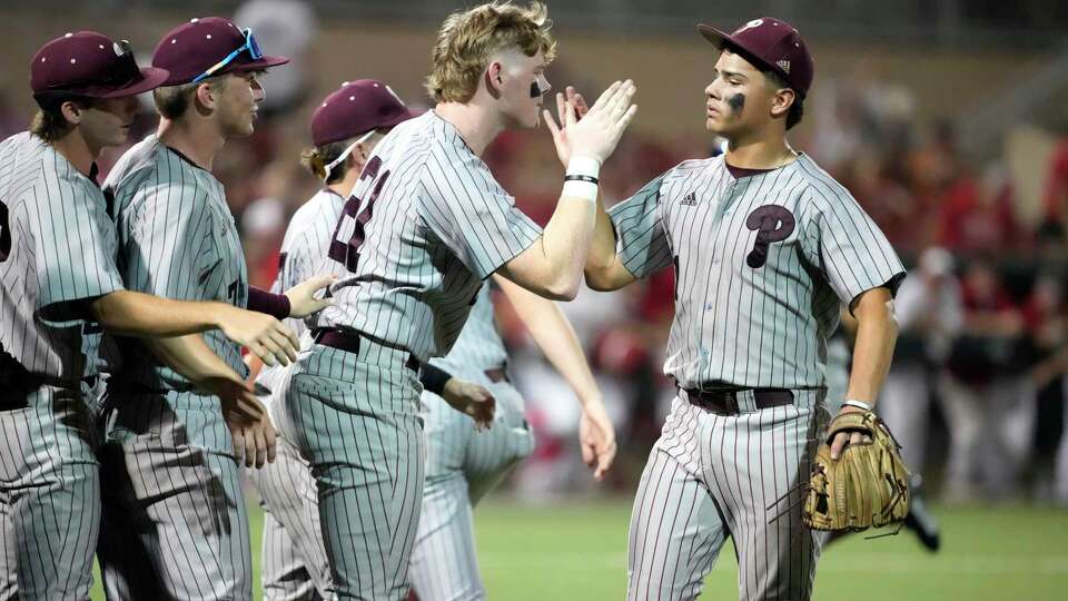 Pearland's starting pitcher Nico Partida (1) reacts with teammates after striking out Memorial's Issac Richardson during the third inning of game 3 of a Region III-6A semifinal baseball game at Schroeder Park on Sunday, May 26, 2024, in Houston.