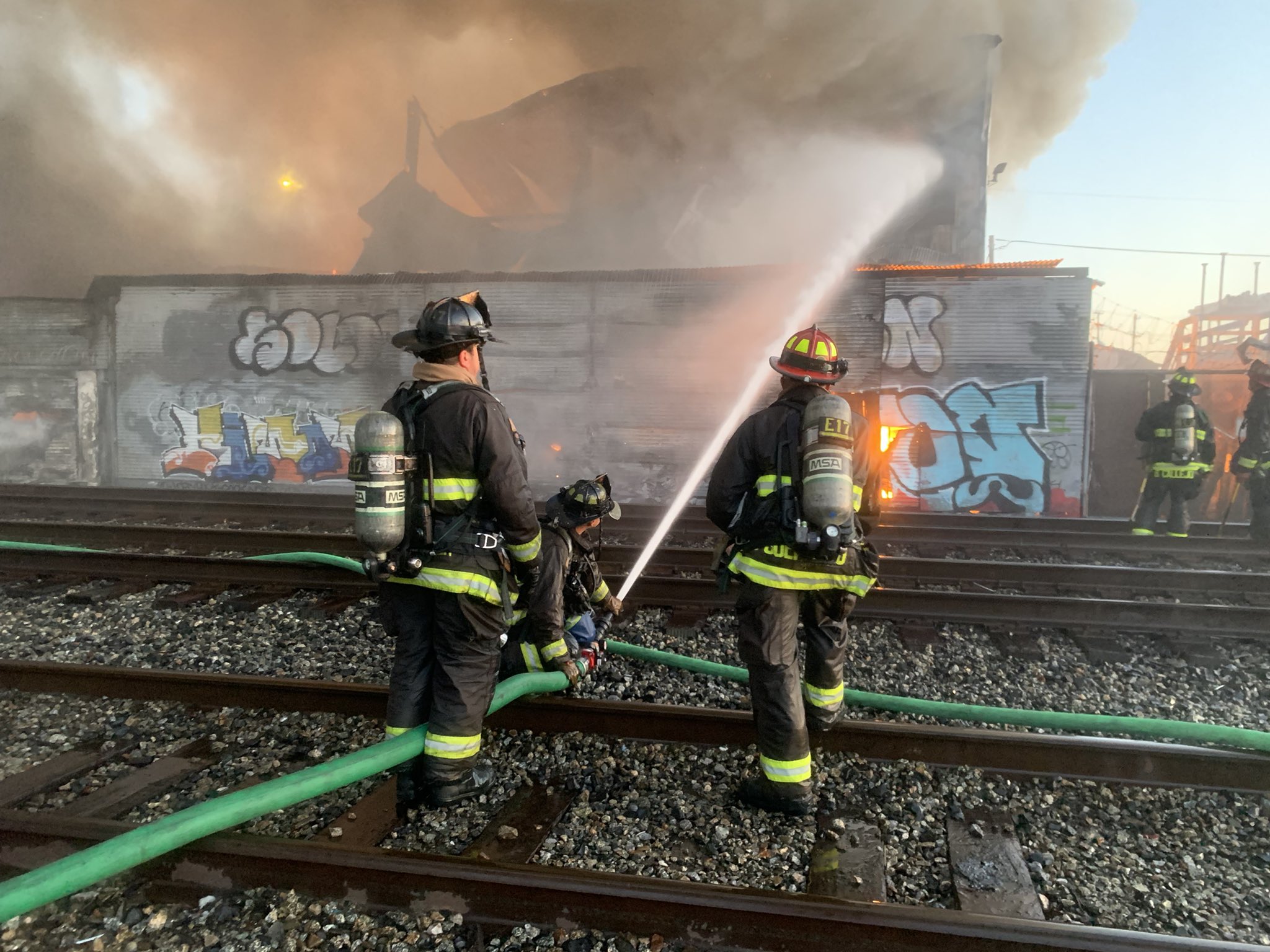 Firefighters battle large fire at Oakland lumber yard