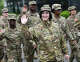 Juliet Huntley, of the Connecticut Army National Guard, marches in the Darien Memorial Day Parade from the Goodwives Shopping Center to Spring Grove Veterans Cemetery in Darien, Conn. May 27, 2024. A brief ceremony honoring Darien's veterans was held inside the library due to weather conditions following the parade.