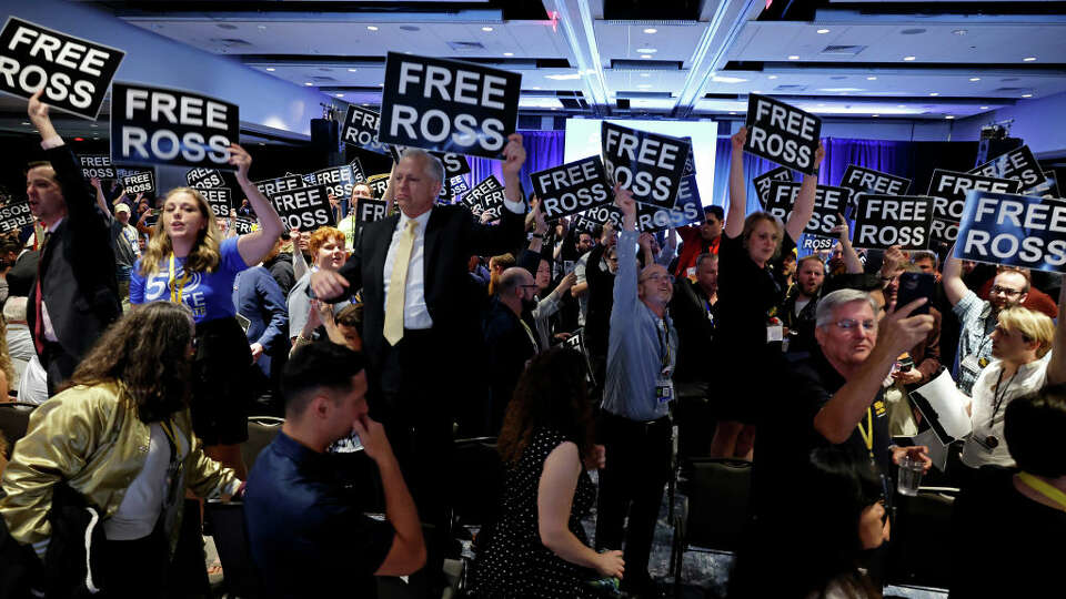 WASHINGTON, DC - MAY 25: Members of the Libertarian Party stand in chairs while chanting and demanding the release of Ross Ulbricht during the party's national convention at the Washington Hilton on May 25, 2024 in Washington, DC. Ross Ulbricht is the founder of the darknet site Silk Road and is currently serving a life sentence in federal prison. Former U.S. President Donald Trump is running for a second term in the White House as a Republican and is scheduled to address the convention one day after Robert F. Kennedy Jr., the independent candidate for president. 