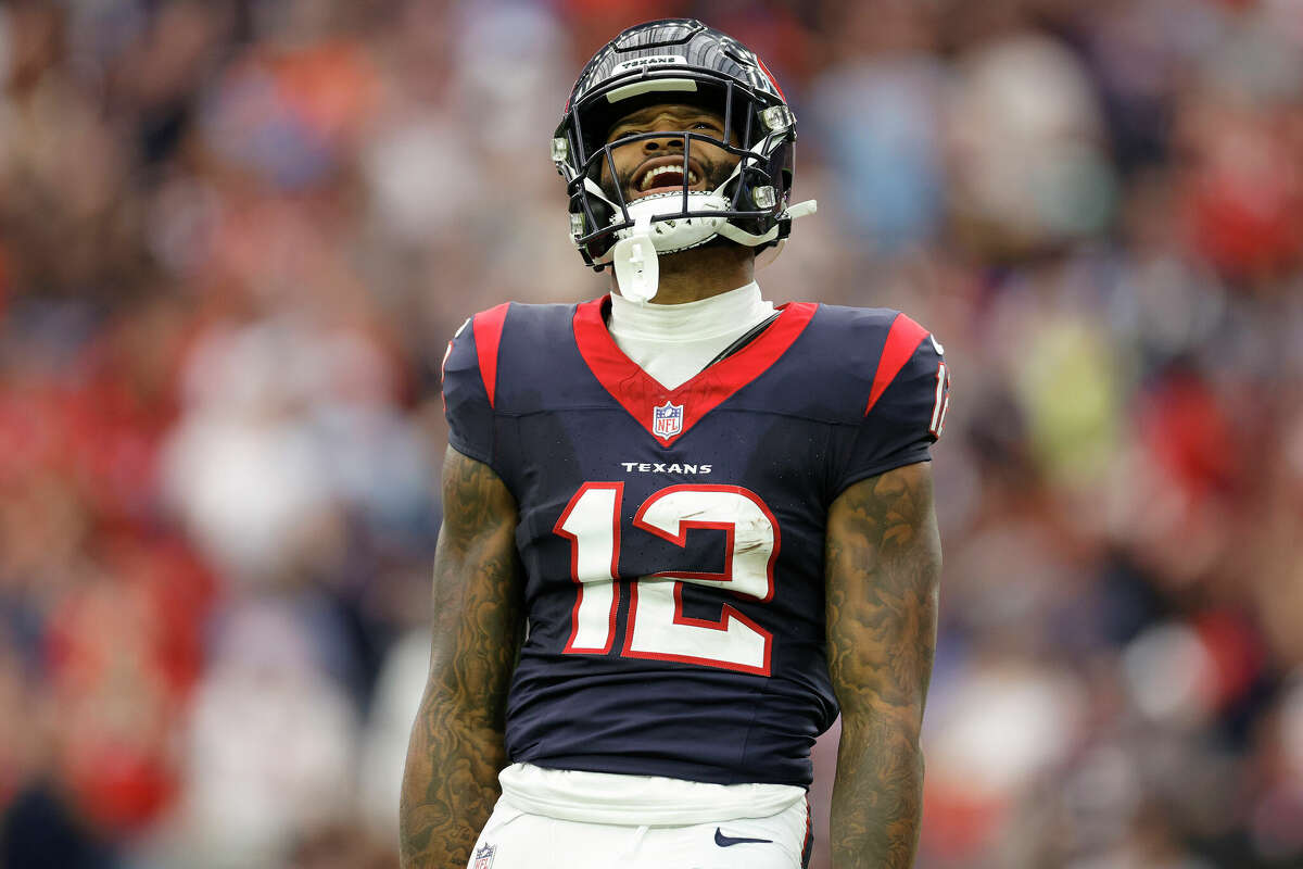 Nico Collins #12 of the Houston Texans reacts after making a catch in the first quarter against the Denver Broncos at NRG Stadium on December 03, 2023 in Houston, Texas. 