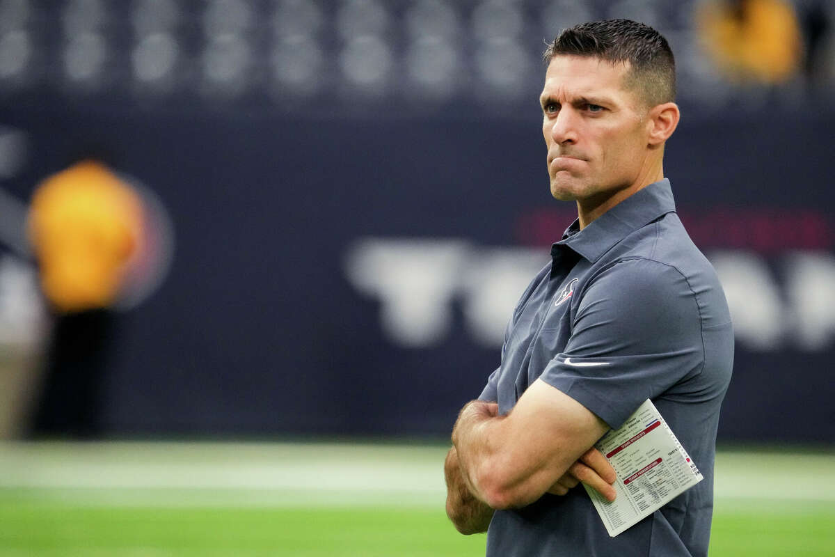 Houston Texans general manager Nick Caserio watches warm ups before an NFL football game against the New Orleans Saints Saturday, Aug. 13, 2022, in Houston.