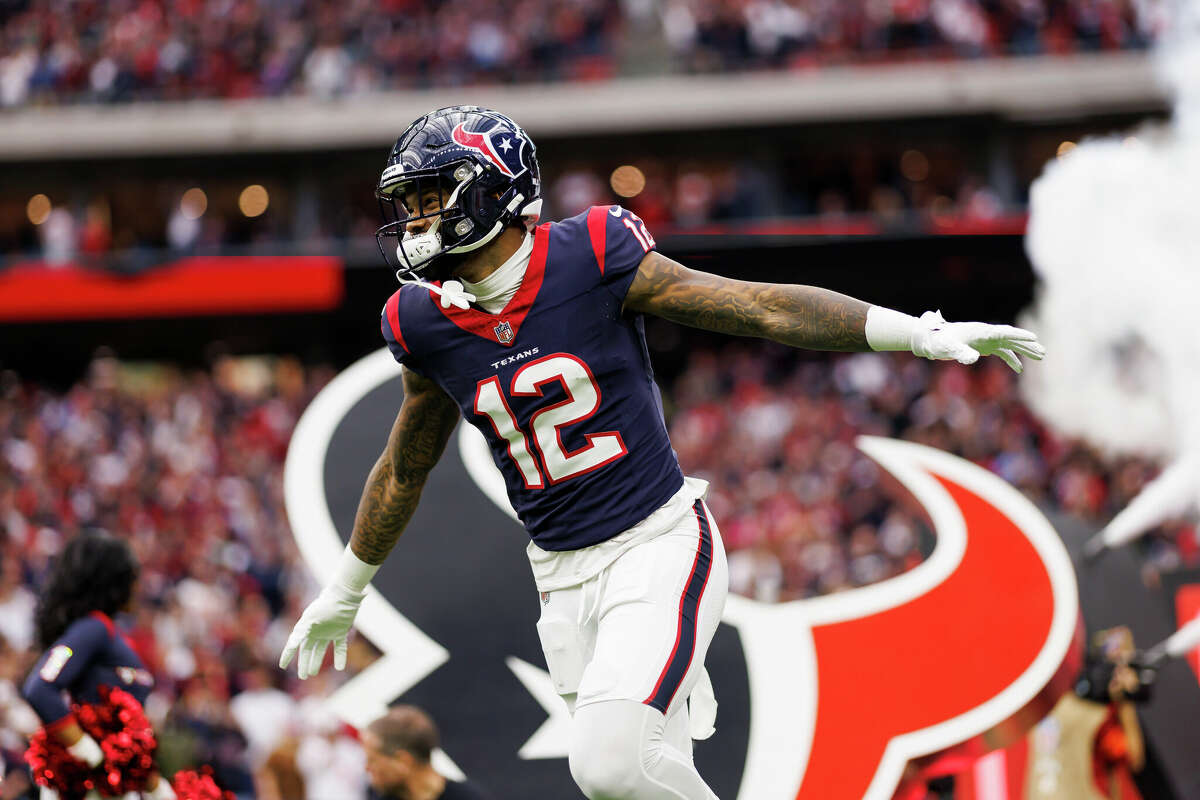 Nico Collins #12 of the Houston Texans celebrates as he runs onto the field during player introductions before an AFC wild-card playoff football game against the Cleveland Browns at NRG Stadium on January 13, 2024 in Houston, Texas.